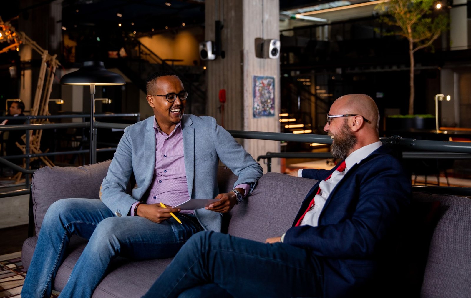 Hassan Yusuf discussing business with a contact